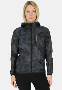 Black windbreaker jacket with a textured, layered design. Features a hood, full zipper, and purple accents on the zip pull and logo.