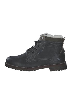 Black leather ankle boot with textured surface, white fur lining, lace-up closure, and rubber sole featuring prominent tread pattern.