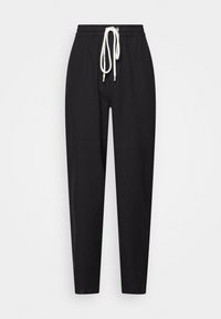 Svarta sweatpants med dragsko i midjan, smalnande bendesign och mjuk tygkvalitet. Har en vit dragsko för kontrast.