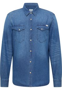 Sinine teksasärk pikkade varrukatega, nööbitav krae, kaks rinnataskut ja metallnööbid. Omab veidi tuhmistunud tekstuuri.