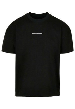 Must musta t-särk ümmarguse kaeluse, lühikeste varrukatega ja väikese valge logotekstiga "MJGONZALES™", mis on trükitud ette.