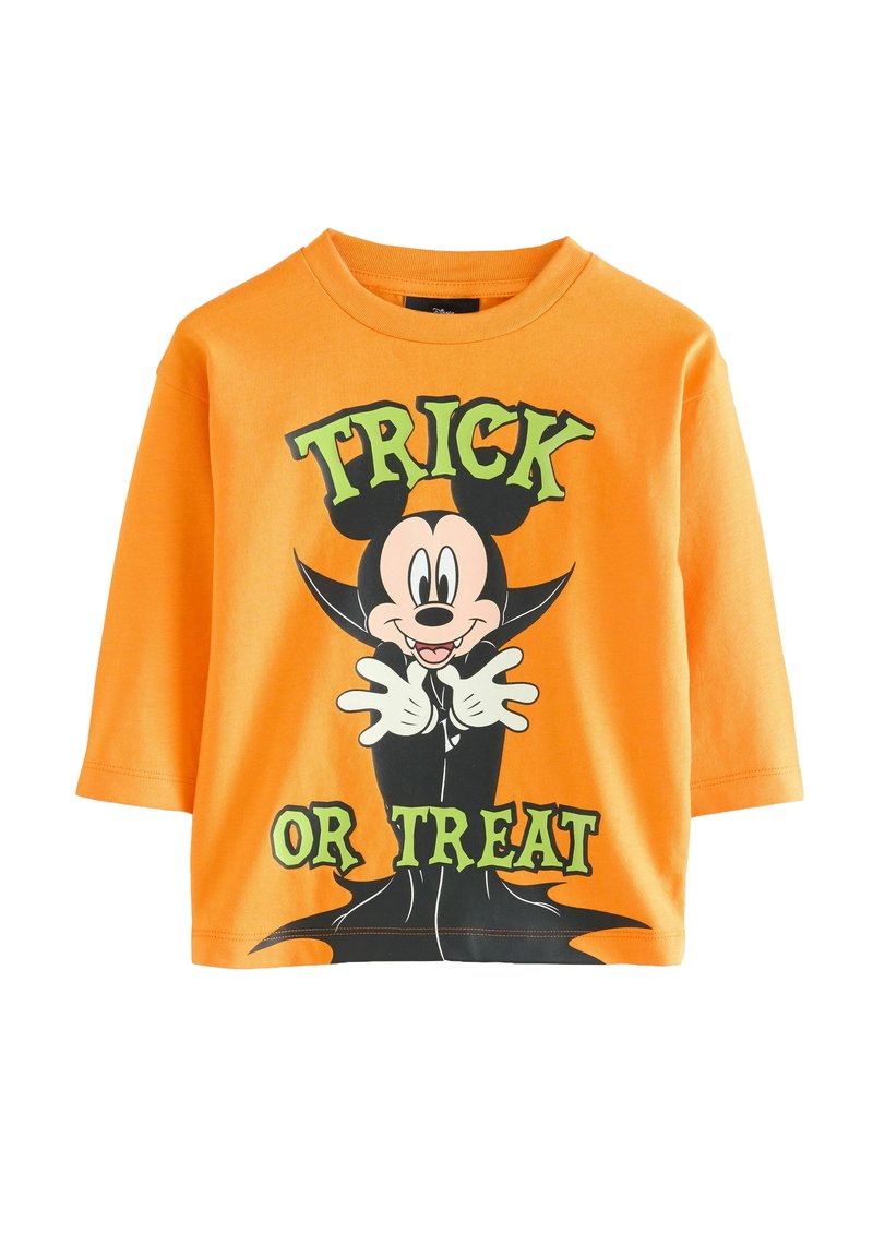 Oranžové bavlnené tričko s kreslenou postavičkou v smokingu, s textom "TRICK OR TREAT" v zelenej farbe, čiernymi akcentmi a klasickým okrúhlym výstrihom.