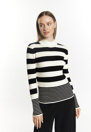 Mustat ja valkoiset raidalliset ribbikuvioiset poolopaidat pitkillä hihoilla, joissa on vaihteleva raidan leveys ja tiukka muotoilu vyötäröllä.