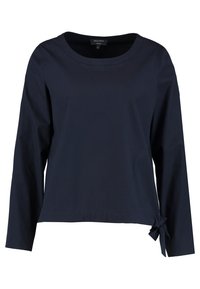 Mörkblå långärmad topp i bomull, med rund halsringning och en knuten detalj på vänster sida för extra stil.
