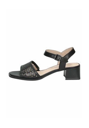 Sandale noire avec un design perforé comprenant des motifs découpés, un bout carré, un talon bloc et une bride de cheville réglable.