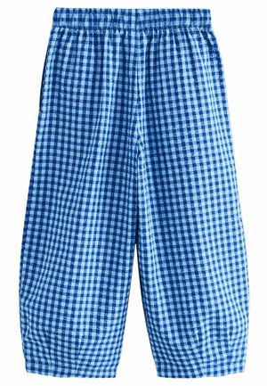 Pantalones de cuadros azules con cintura elástica, fabricados con un tejido ligero y con puños fruncidos en el tobillo para dar una forma ajustada.