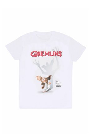 Bílé bavlněné tričko s grafikou malého tvora s velkýma ušima a hravým výrazem, doplněné textem „Gremlins“ a popisy.