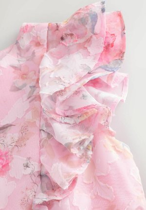 Rožinė gėlių bluzonė, pasižyminti permatoma medžiaga su sluoksniuotais volanais. Dizainas apima šviesius gėlių raštus švelniuose atspalviuose ir subtiliais kraštais.
