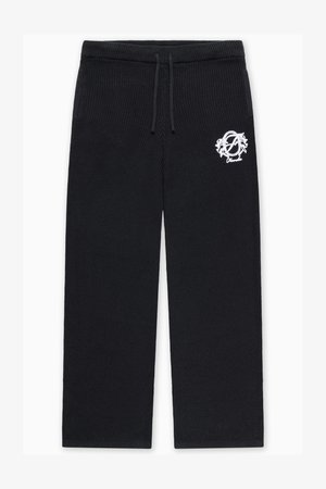 Pantaloni neri in maglia con vestibilità rilassata, dotati di vita con coulisse e logo ricamato in bianco sulla coscia sinistra.