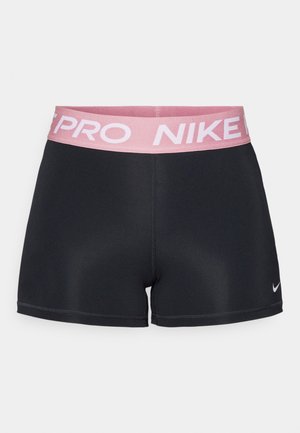 Svarta träningsshorts med ett rosa elastiskt midjeband som har "NIKE PRO"-text. Tillverkade av ett mjukt, stretchigt tyg med en figurnära design.
