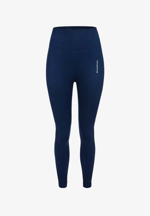 Námořnické modré legíny s vysokým pasem, vyrobené z elastického materiálu. Mají vroubkovanou strukturu a malou bílou logovou aplikaci na boku.