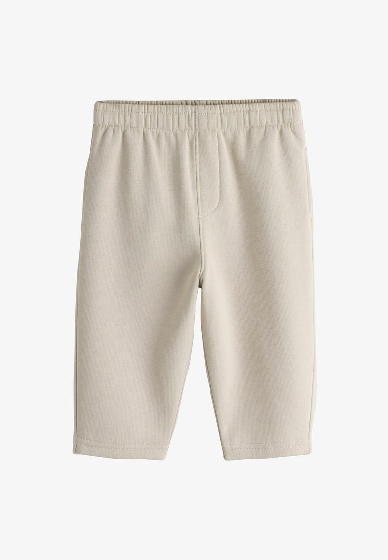 Pantalones cortos de jersey de algodón beige con cintura elástica, corte hasta la rodilla y textura suave. Sin bolsillos visibles ni adornos.