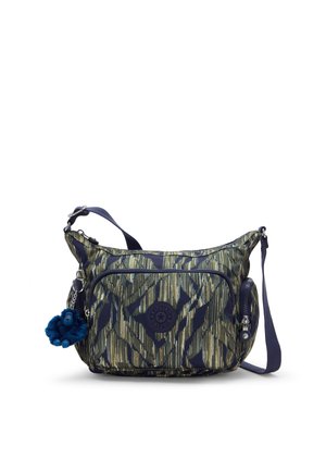 Sac bandoulière avec motif abstrait vert et marine, poche avant zippée, poche latérale zippée, sangle marine réglable et porte-clés singe en peluche bleu.