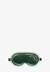 Groene satijnen slaapmasker met kant, met een strikaccent. Zachte textuur, contoured vorm voor comfort, elastische band voor een veilige pasvorm.