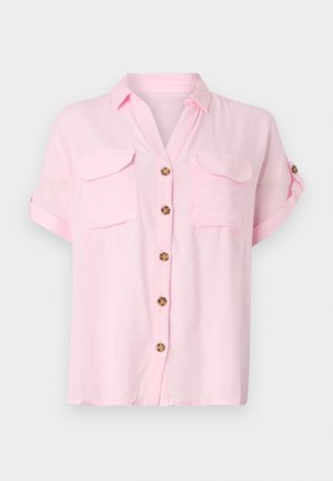 Hele roosa lühikese varrukaga särk nööpidega ees, kahe rinnatasku ja üleskeeratud varrukatega. Valmistatud pehmest ja kergest kangast.