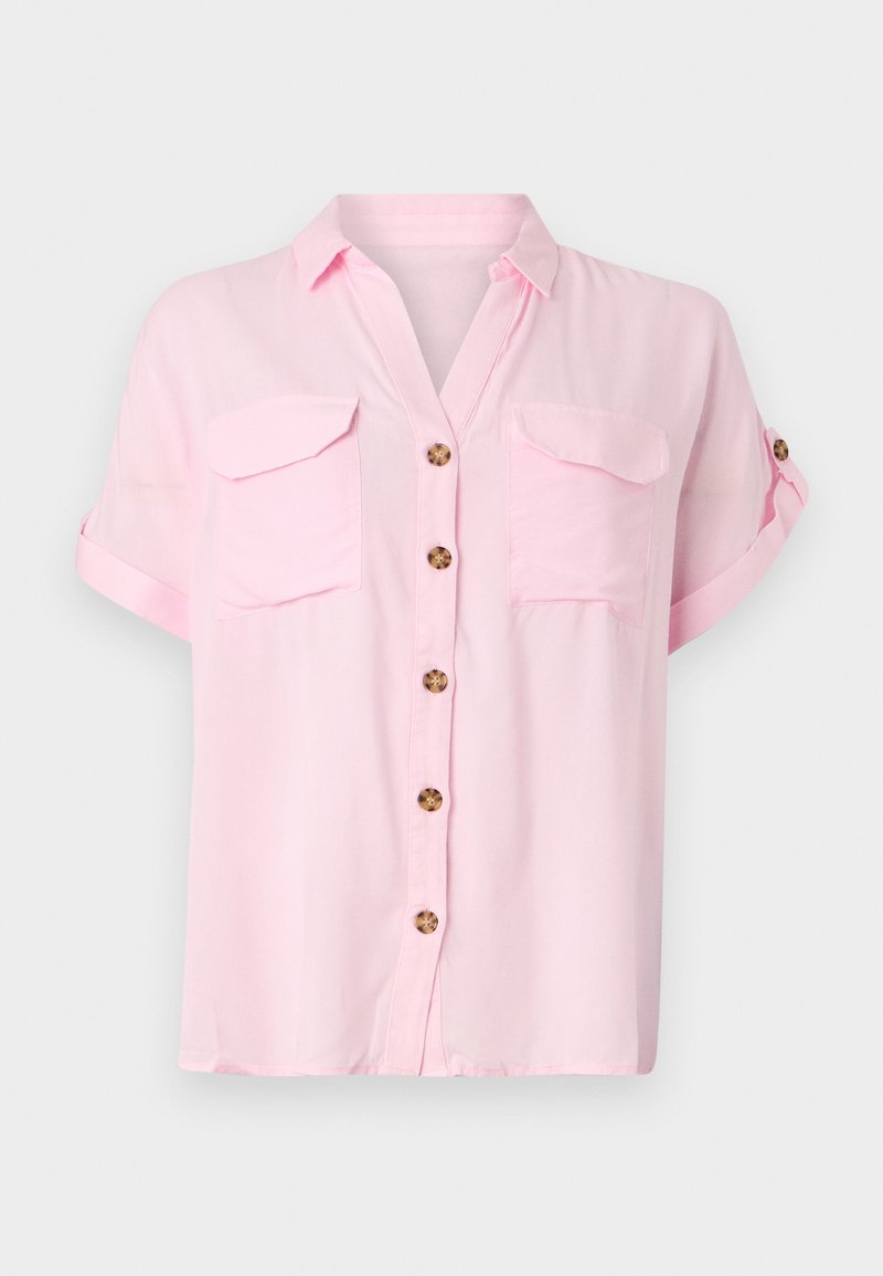 Chemise légère rose clair à manches courtes avec boutonnière à l'avant, deux poches poitrine et manches retroussées. Fabriquée en tissu doux et léger.