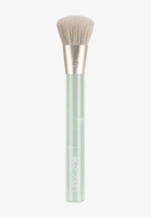 Brocha de maquillaje con cerdas suaves beige, férula dorada y mango verde claro etiquetado con "ecotools" sobre fondo blanco.