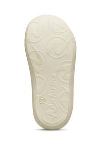 Suola di scarpa in gomma color crema con superficie testurizzata, caratterizzata da un motivo di logo circolare e un nome di marca prominente lungo il bordo.