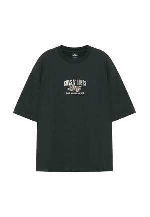 T-shirt noir à manches courtes avec texte blanc « "Guns N' Roses Los Angeles, CA" » et motif de rose centré sur la poitrine.