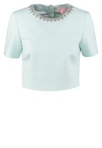 Light blue cropped top with short sleeves, featuring a beaded neckline and a zipper closure at the back. Smooth, structured fabric.