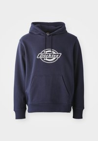 Hoodie bleu marine en mélange de coton. Doté d'une poche frontale et d'une capuche avec cordon de serrage. Logo "Dickies" blanc sur la poitrine dans un design circulaire.