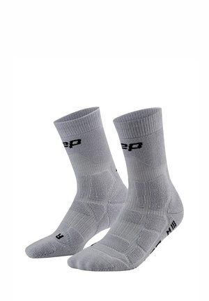 Pair of gray crew socks with ribbed cuffs and black lettering, designed for left and right feet, shown against a white background.