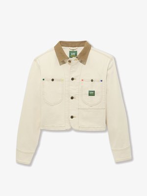 Κοντό κρέμα μπουφάν με καφέ κοτλέ γιακά, δύο μπροστινές τσέπες και χρωματιστά κουμπιά (πράσινο, ροζ, μπλε) στις τσέπες του στήθους.