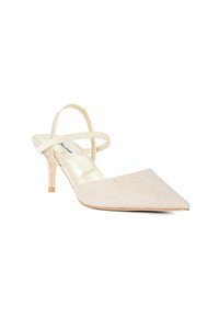 Pointed-toe slingback heels in a light metallic beige fabric. Features two crossed straps, a 3-inch stiletto heel, and a smooth inner lining.