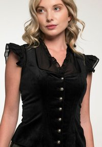 Zwart fluwelen top met ruffles aan de korte mouwen, V-hals en negen decoratieve zilveren knopen aan de voorkant, met een getailleerd design.