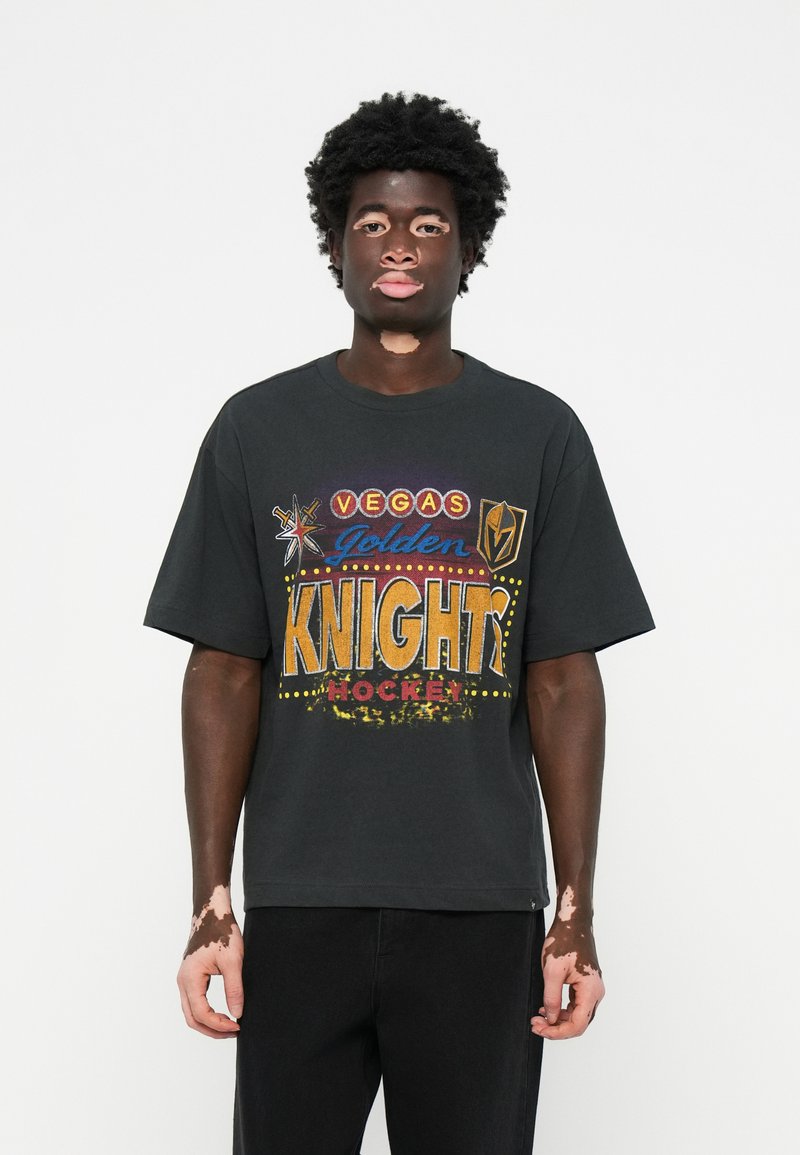 Black cotton t-shirt featuring bold multicolored print with "VEGAS GOLDEN KNIGHTS HOCKEY" text, short sleeves, loose fit. Casual style.