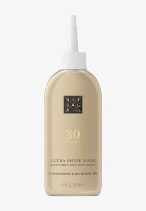 Bouteille en plastique couleur crème avec un embout pointu. L'étiquette présente le texte "Masque Ultra Brillance 30 Secondes" dans des couleurs contrastantes. Taille : 200 ml.