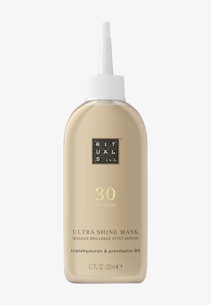 Bouteille en plastique couleur crème avec un embout pointu. L'étiquette présente le texte "Masque Ultra Brillance 30 Secondes" dans des couleurs contrastantes. Taille : 200 ml.