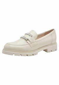 Mocassino in faux leather crema con una suola piatta e spessa. Presenta dettagli decorativi in argento e cuciture lungo la parte superiore.