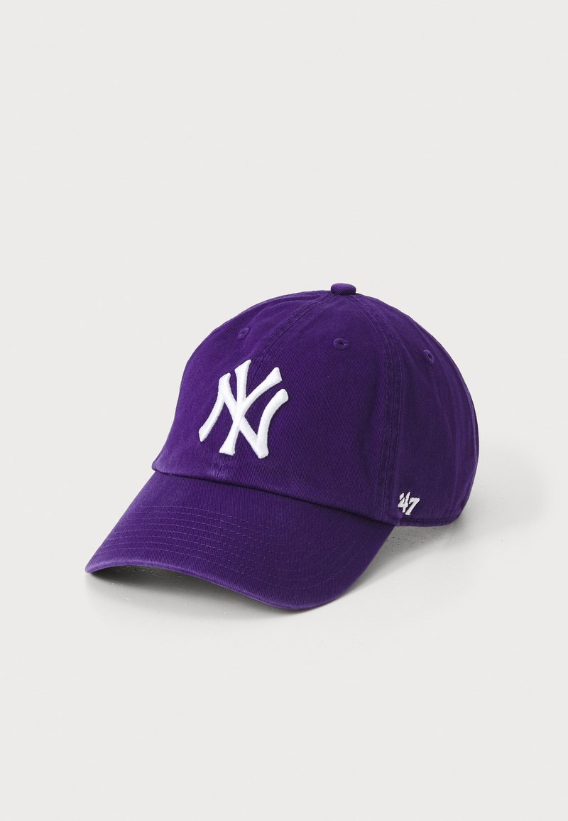 Purple cotton baseball cap with a curved brim, featuring white embroidered letters "NY" on the front and a small white logo on the side.
