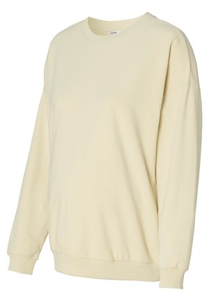 Helles gelbes Sweatshirt aus weichem Stoff. Verfügt über einen runden Ausschnitt, überschnittene Schultern und gerippte Bündchen sowie einen gerippten Saum.