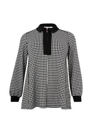 Black and white houndstooth patterned blouse with a black collar, long sleeves, and a front placket with a zip closure. Smooth texture.