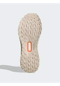 Sports shoe outsole featuring a textured, beige rubber design with triangular treads and an orange accent near the center.