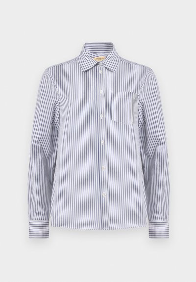 Πουκάμισο με μακριά μανίκια και κουμπιά, με κάθετες μπλε και άσπρες ρίγες, μυτερό γιακά, μία τσέπη στο στήθος και κουμπωτά μανίκια.
