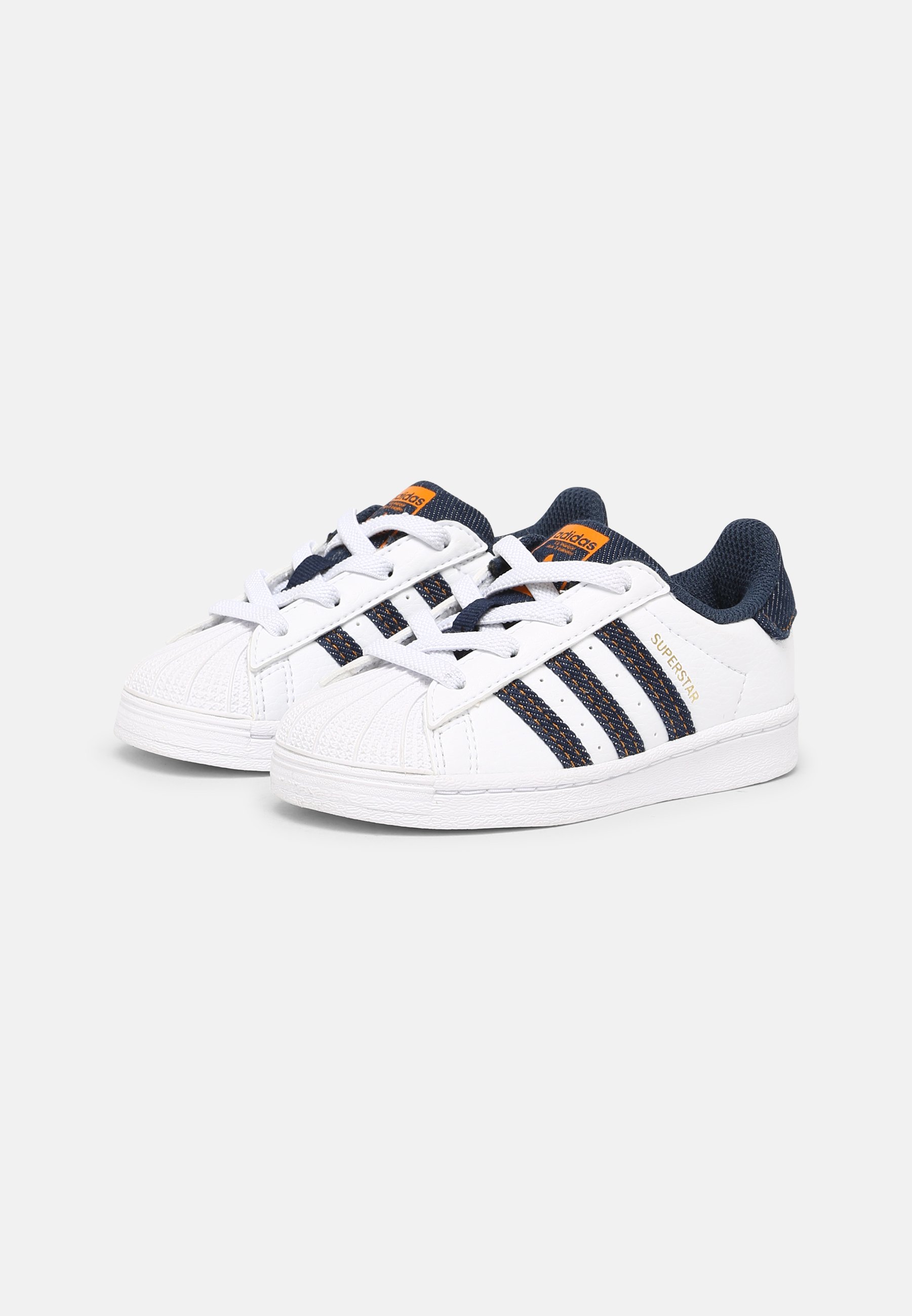 white navy adidas superstar