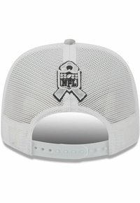 White mesh trucker cap with a curved visor, featuring an embroidered NFL logo and ribbon detail on the back. Adjustable snap closure.