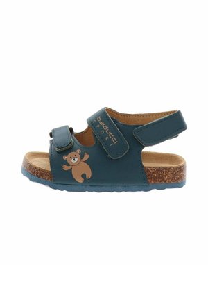 Sandalo blu per bambini con cinturini regolabili, suola in sughero e grafica di un orsacchiotto sul lato.