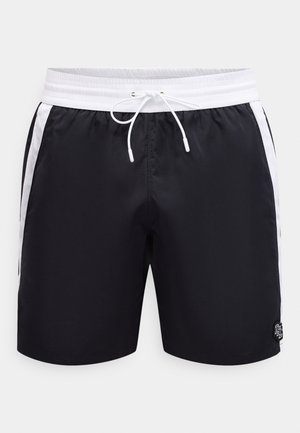 Mustat uimashortsit, joissa valkoinen joustava vyötärönauha, valkoiset sivuraidat ja edessä kiristysnauha, pienellä logolla oikean etujalan alareunassa.