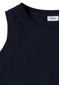 Top sans manches bleu marine avec encolure ronde et étiquette de marque "Cecil" cousue à l'intérieur du col arrière.