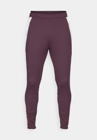 Pantalones deportivos en color burdeos, fabricados con un material elástico. Presentan paneles laterales blancos y detalles en rojo. Diseño de pierna ajustada con cintura elástica.
