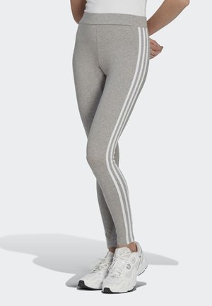 Graue Leggings mit weißen Streifen an den Seiten, aus einem elastischen, weichen Material gefertigt, mit hohem Taillenbund und Knöchellänge.
