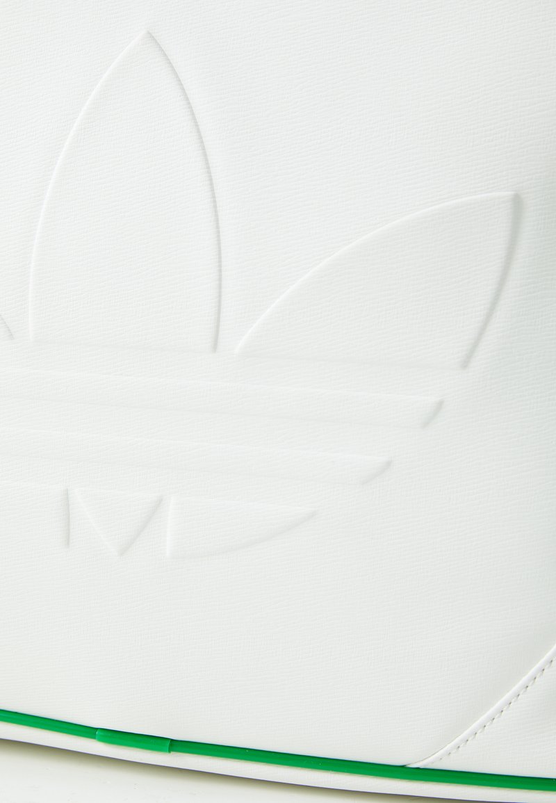 White textured bag featuring embossed logo with three petals and two horizontal stripes. Green accent at the bottom. Smooth finish.