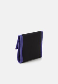 Black wallet with purple stitching and trim, made from textured fabric. Compact, foldable design with no visible logos or patterns.