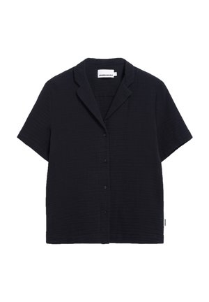 Chemise à manches courtes, bleu marine foncé, avec un devant boutonné, un col en V et un tissu texturé. Elle présente une petite étiquette de marque sur la couture latérale.