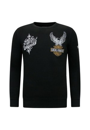 Zwarte trui met lange mouwen met witte en gouden grafische ontwerpen van een adelaar en de woorden "Local Fanatic" en "Honor Loyalty" op de borst.