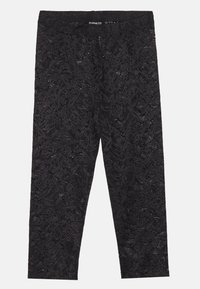 Sorte blondeleggings med blomsterdesign, elastisk liv, og en tettsittende fasong. Lett materiale med en teksturert overflate.